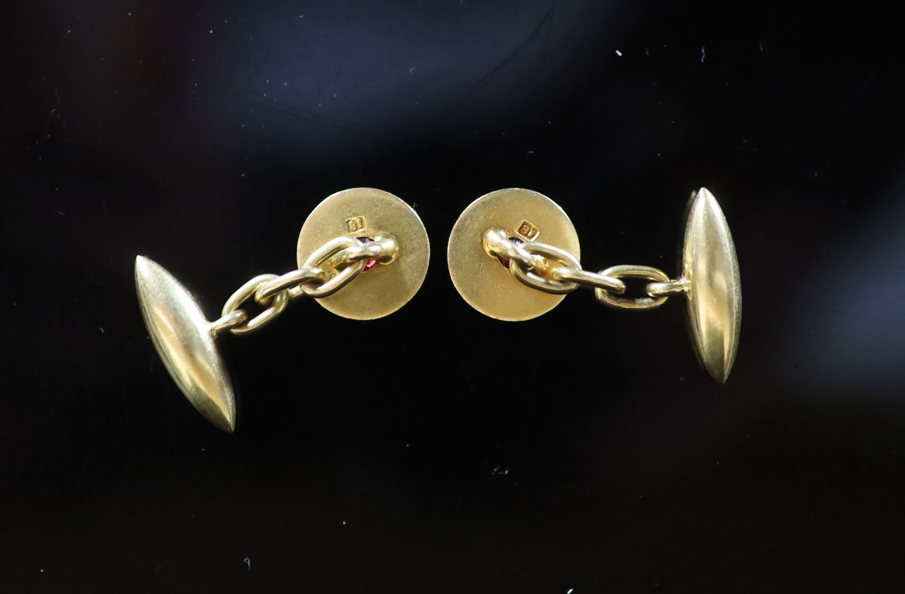 A pair of 18ct gold and ruby set disc cufflinks